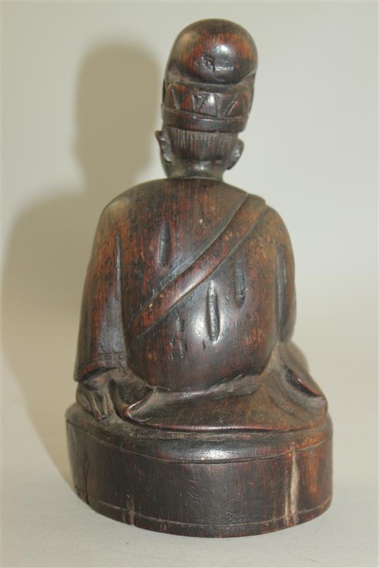 A Chinese Jichimu seated figure of a monk, 19th century, 8cm